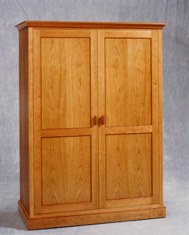 Armoire in cherry and makore. Armoire in cherry and makore.